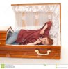 yawning-stretching-woman-coffin-16819440.jpg